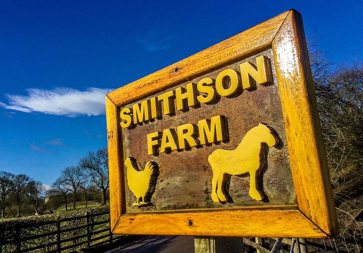 Smithson Farm campsite entrance sign at Woodend Road, Reedley Hallows, Burnley